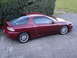 1993 Mazda MX-3 - The 1993 Mazda MX-3 coupe is seen here in a 3/4 front profile, its distinctive body style.