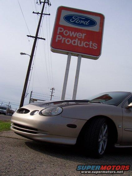 1998 Mercury Sable front end with a Ford Power Products sign in the background