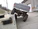 1979 Ford Bronco - Modified Ford pickup truck with large tires navigating a concrete obstacle. License plate 324SE is visible.
