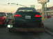 1993 Ford Taurus - Rear view of a green 1993 Ford Taurus being transported on a trailer.