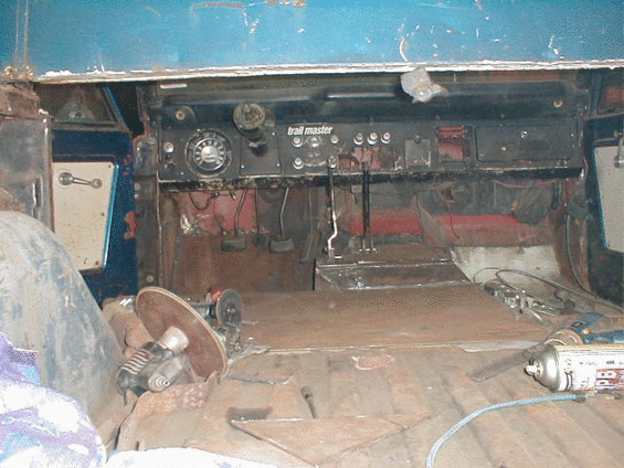 Undercarriage of a vehicle with visible suspension components and exhaust system
