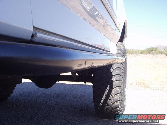 1993 Ford Bronco side view showing the lower body panel and a large off-road tire