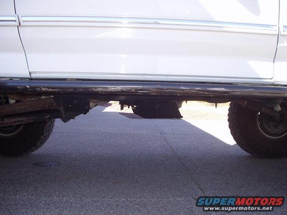 White 1993 Ford Bronco side view showing running board and tire