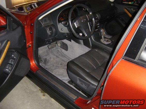 Orange car interior with black leather seats and dashboard