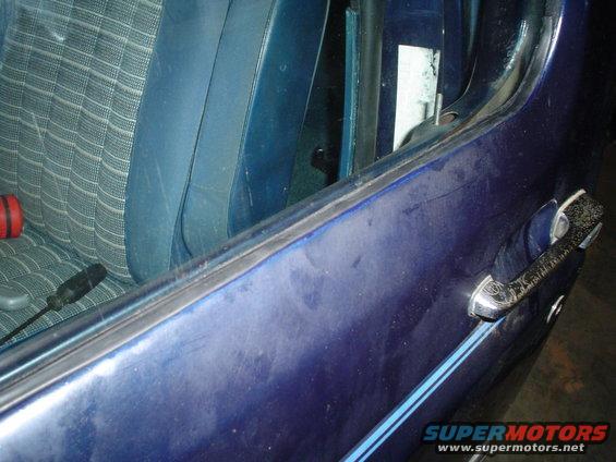 Blue patterned seat and door handle inside 1984 Ford Bronco