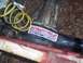 1995 Toyota Tacoma - Close-up of a differential housing with a "Longfield Super Axles" sticker and a yellow hose.