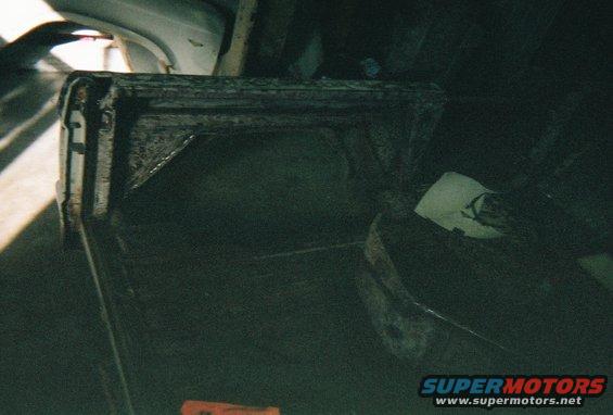 Removing the rear wheel wells to move them back 4 1/2" to be centered over the wheels when the axle is moved back.