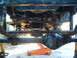 1994 Jeep YJ - Underside view of a 1994 Jeep YJ showing the front axle and suspension system.