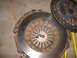 2004 Jeep Wrangler - Clutch pressure plate and disc assembly shown on a concrete surface with a SuperMotors logo in the corner.