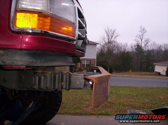 Red 1995 Ford Bronco front bumper with custom metal addition