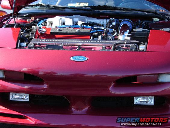 Red 1994 Ford Probe engine bay with hood open