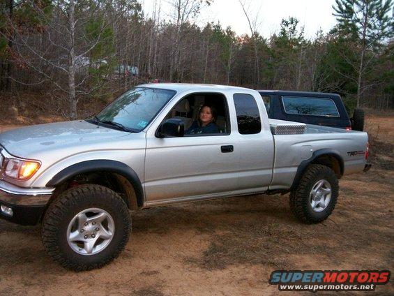 100_0012.jpg My g/f Irma in the 03 Tacoma with the 93 Bronco parked behind it