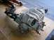 1979 Chevrolet C/K Pickup - A differential assembly, likely from a truck, is shown on a flat surface with a floor jack in the background.