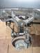 1979 Chevrolet C/K Pickup - Close-up view of a vehicle's front suspension and brake components, including the rotor and caliper, with a website watermark visible.