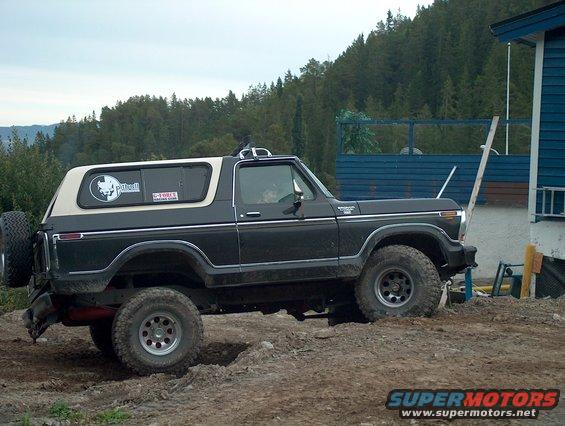 Black and tan 1979 Ford Bronco, 3q-front view, with a spare tire on the rear