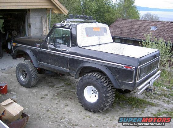 Black 1979 Ford Bronco with lifted suspension and off-road tires parked outdoors