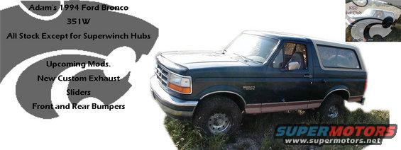 1994 Ford Bronco with dark green body and tan top, parked on grass