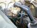 Angle shot of CJ2A 64 Ford Falcon Holley carb and open top of distributor