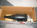 1985 Ford Crown Victoria LTD - A black automatic transmission is shown inside its shipping box, resting on wooden supports.
