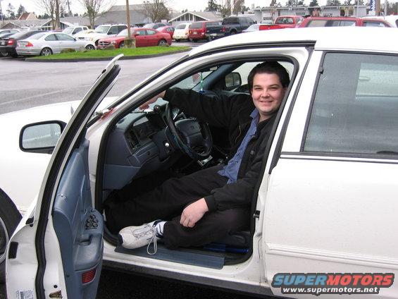 1999 Ford Crown Victoria interior with man in driver's seat