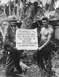 1995 Ford Bronco - Marines and Coast Guard members pose with a sign during the invasion of Guam.