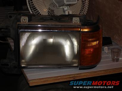 Headlight assembly with clear lens and amber turn signal