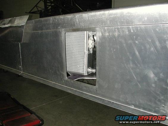 Close-up of a drag car's aluminum chassis with a visible radiator