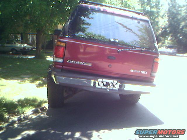 Red SUV rear with license plate AWP 396