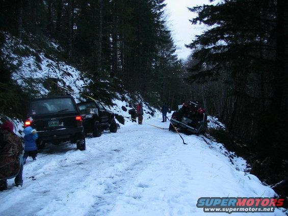 img_0102.jpg Nissan Pick-Up Half Over the Bank
I was able to raise some other 4 wheelers on the CB to come pull him out.
(Stuck) (1/28/2006)