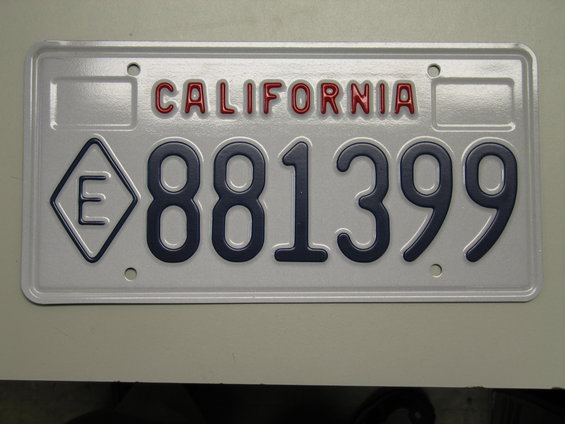 California license plate with the number 881399 and a diamond shape with an E inside