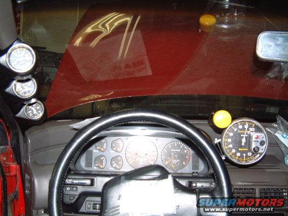 1991 Ford Probe interior with aftermarket tachometer and gauges