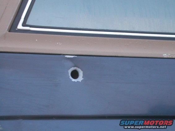 Looking around the service station waiting for a mechanic to show up and fix my fuel pump, I found this Bronco with a big ass bullet hole in it.  Must be a good story there somewhere.