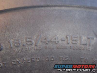 Tire sidewall shows 18.5/44-15LT and other text