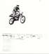 1900 Honda Big Red - A dirt bike rider soars through the air, performing a jump over a barren landscape.