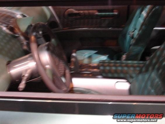 Interior view of car with patterned seats and steering wheel