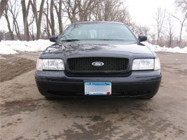 1998 Ford Crown Victoria front view, black paint, Minnesota license plate