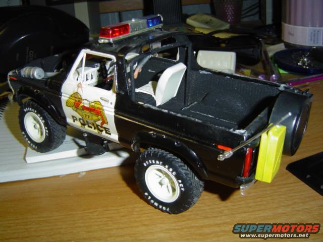 1979 Ford Bronco police model with "POLICE" decals on doors and light bar