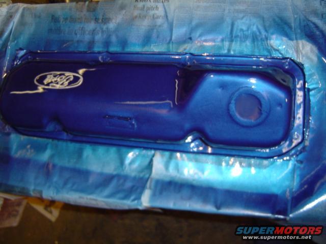 Blue painted Ford valve cover with white oval logo