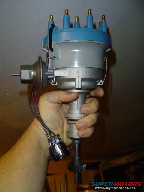 Distributor held in hand, wires attached