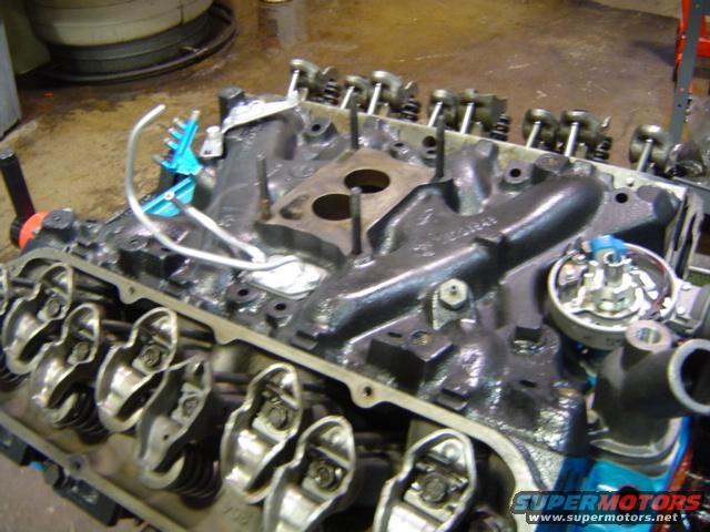 Engine block with intake manifold, distributor, and valve train components visible