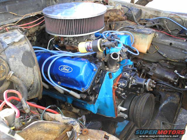 Engine bay with blue Ford valve covers and air filter