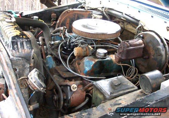 Engine bay with V8 engine, air cleaner, radiator, and brake booster
