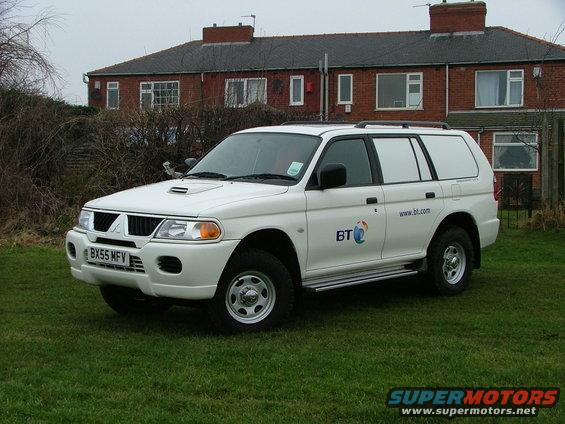 White SUV with BT logo and website on the side. License plate is BX55 MFV