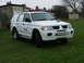 2006 Mitsubishi L200 - This white SUV, marked with a BT logo, has the license plate BX55 MFV.
