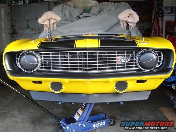 Front view of a yellow 1970 Chevrolet Camaro Z28 with black stripes