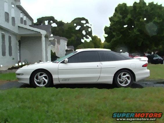 White 1996 Ford Probe GT coupe parked on grass, side view