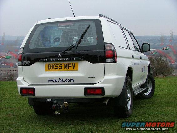 Rear view of white Mitsubishi Shogun Sport SUV with license plate BX55 MFV and www.bt.com sticker
