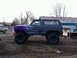 1979 Ford Bronco - This lifted 1979 Ford Bronco features a custom purple fender and flame graphics on its side.