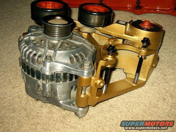 Alternator with a gold-painted bracket and two pulleys visible