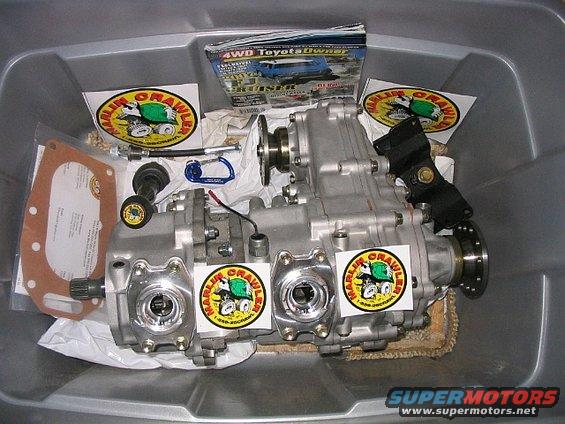 Toyota transfer case with Marlin Crawler stickers and a 4WD Toyota Owner magazine